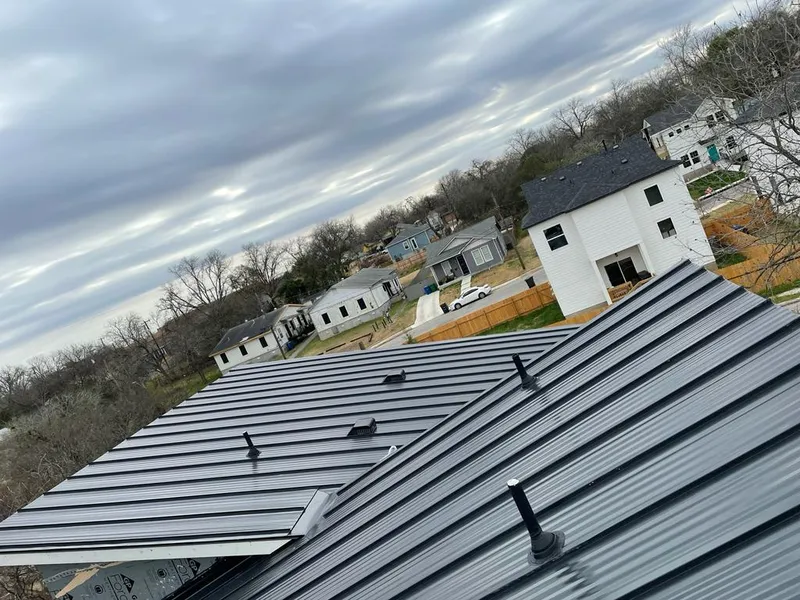 Standing seam metal roof panels with vents for Skylight Repair in Clawson